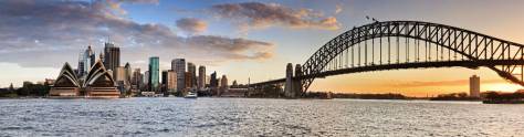 Изображение для скинали: Сидней - оранжевое солнце садится за портовым мостом в широком панорамном виде
